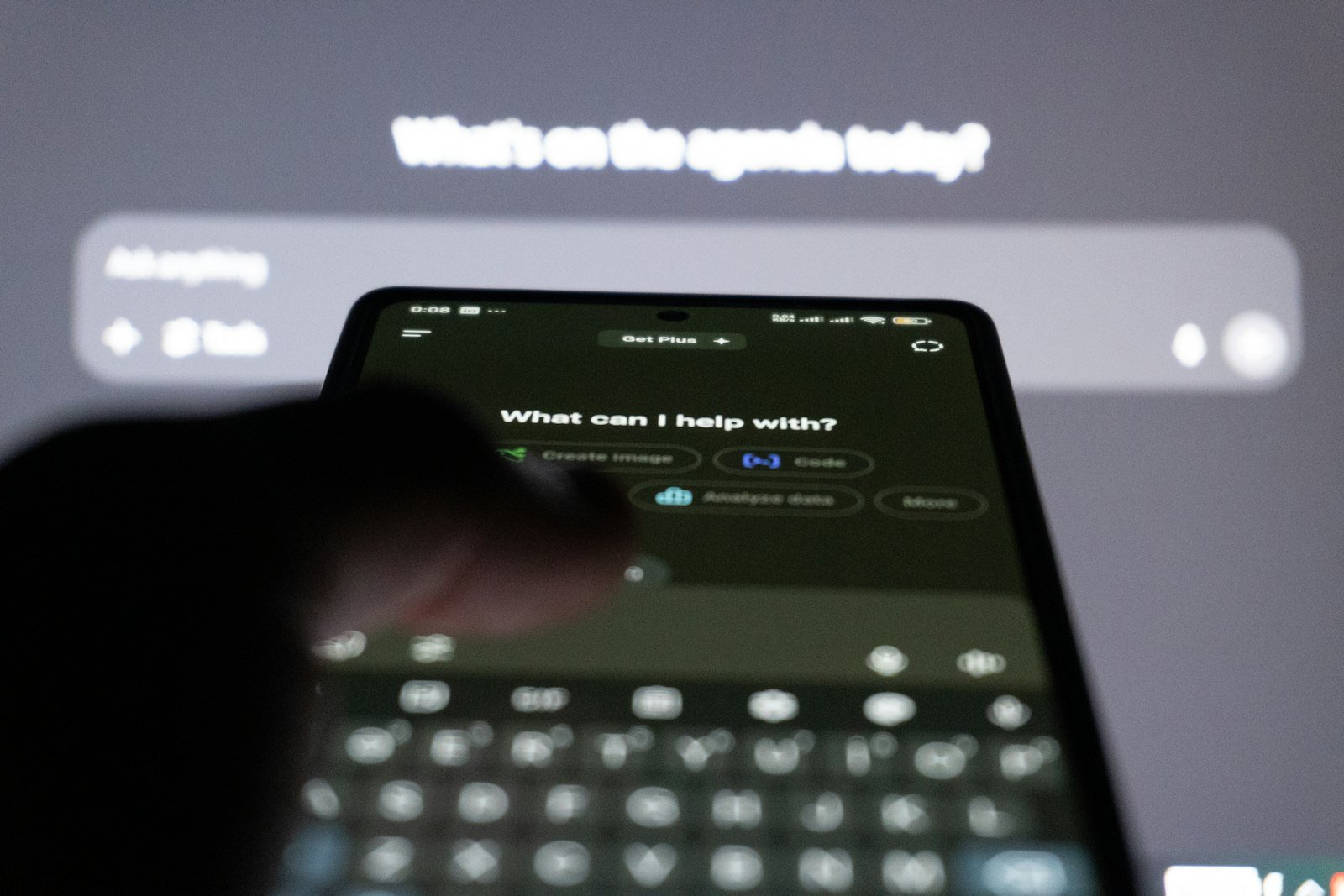 A person typing a message to an AI assistant on a smartphone